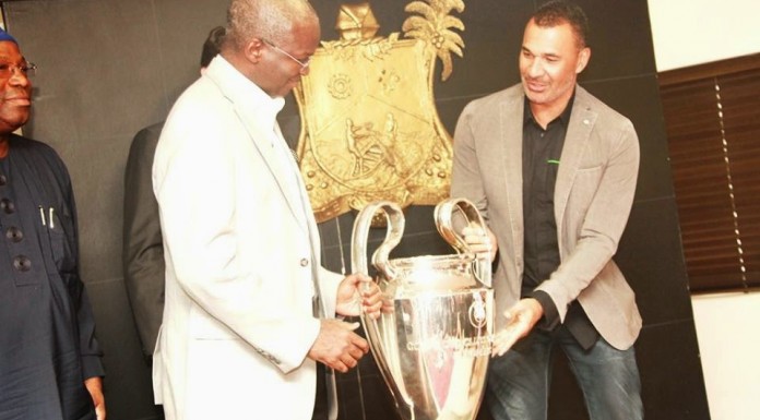 Fashola Receives UEFA Champions League Trophy In Lagos