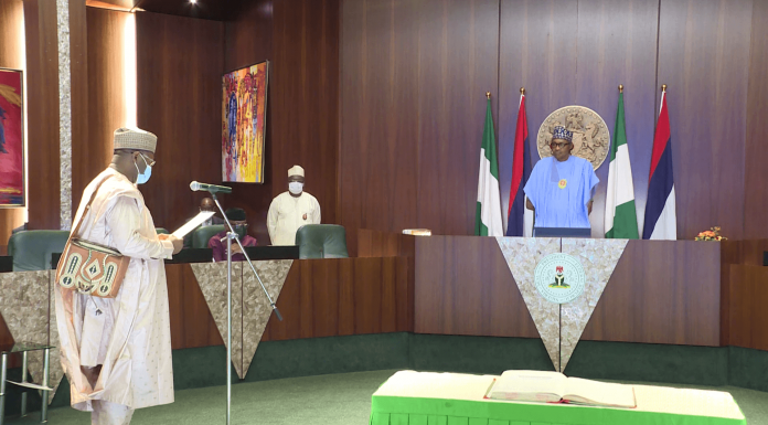 Buhari Swears in Prof Yakubu for a Second Tenure as INEC Chairman