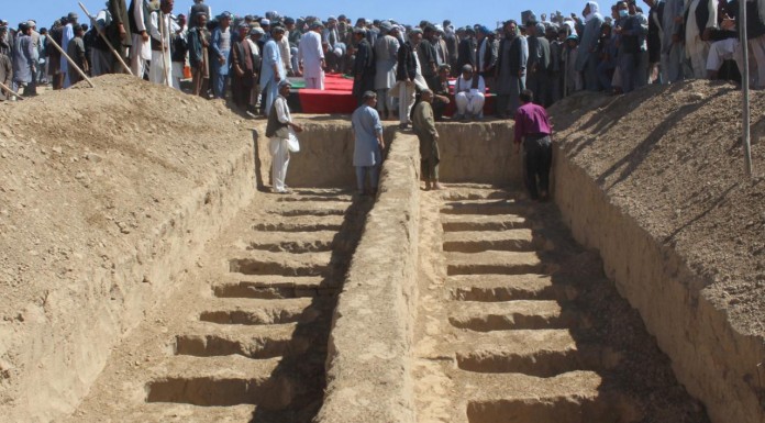 Afghan police discover mass graves in village